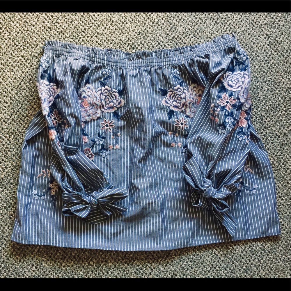 Off the shoulder, half length sleeve blouse.